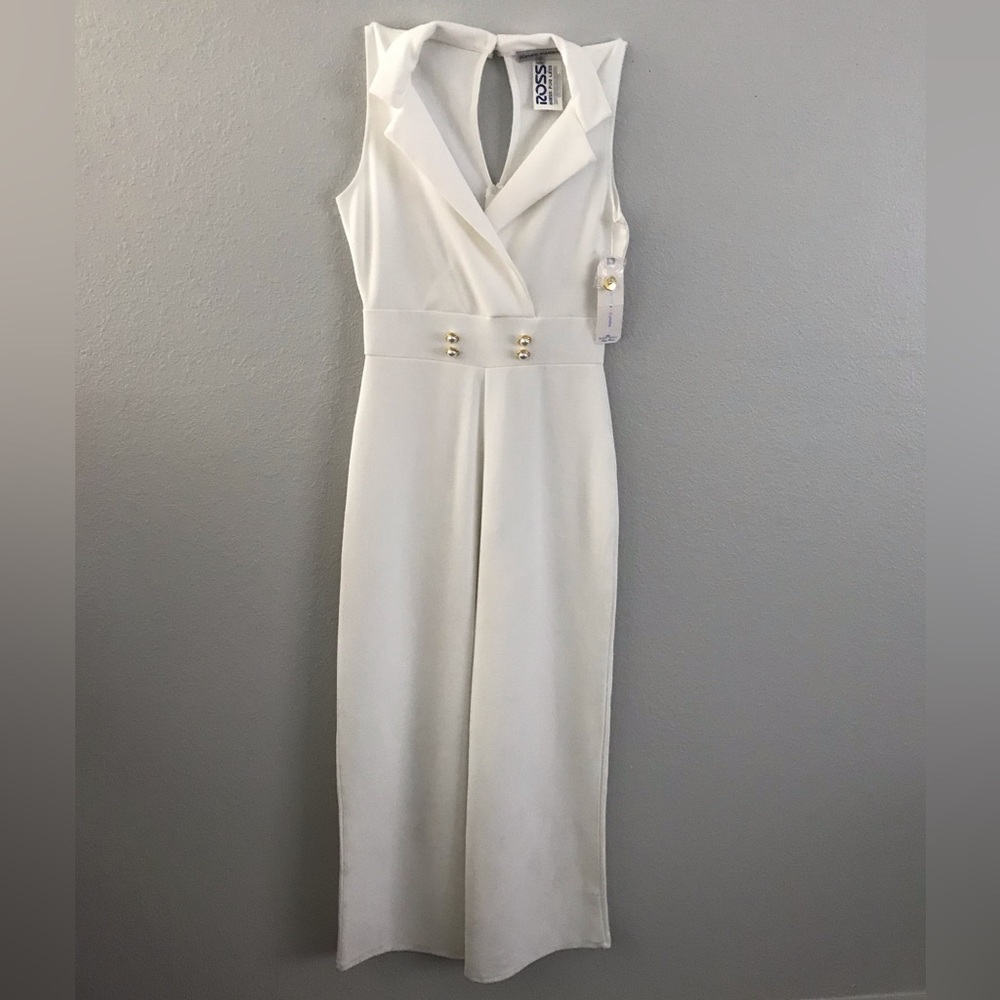 White Jumpsuit sleeveless with some stains at the bottom. Size: M Womens